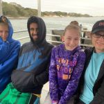 Trying to stay warm on the ferry - winds were strong!