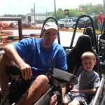 Dad and Trev in their cart.