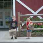 The kids show off their final product (in the box).