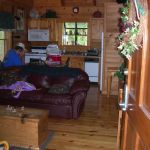 Dad on the phone in our cabin.