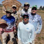 Group photo at the sign