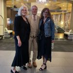 Heather and her parents at the wedding